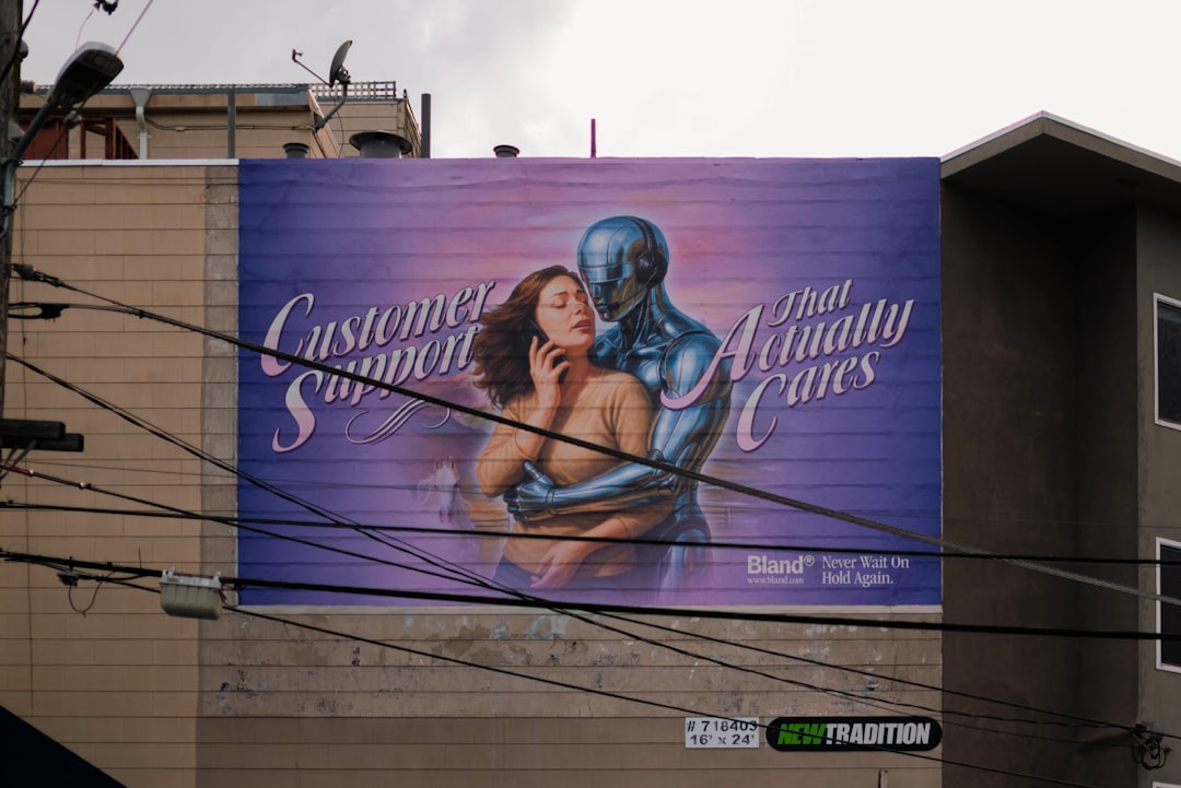 Billboard with woman and robot embracing